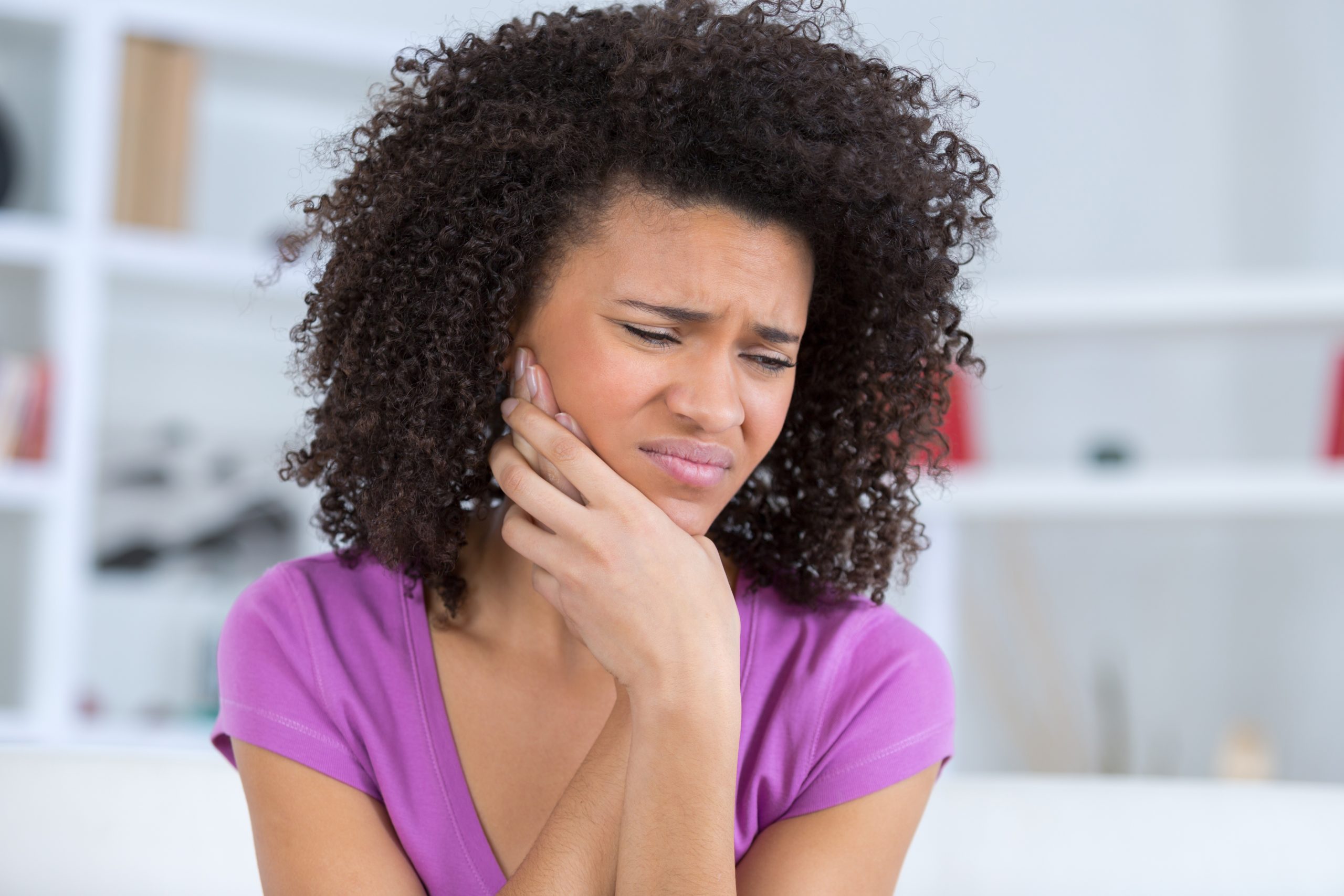 american young woman have a toothache