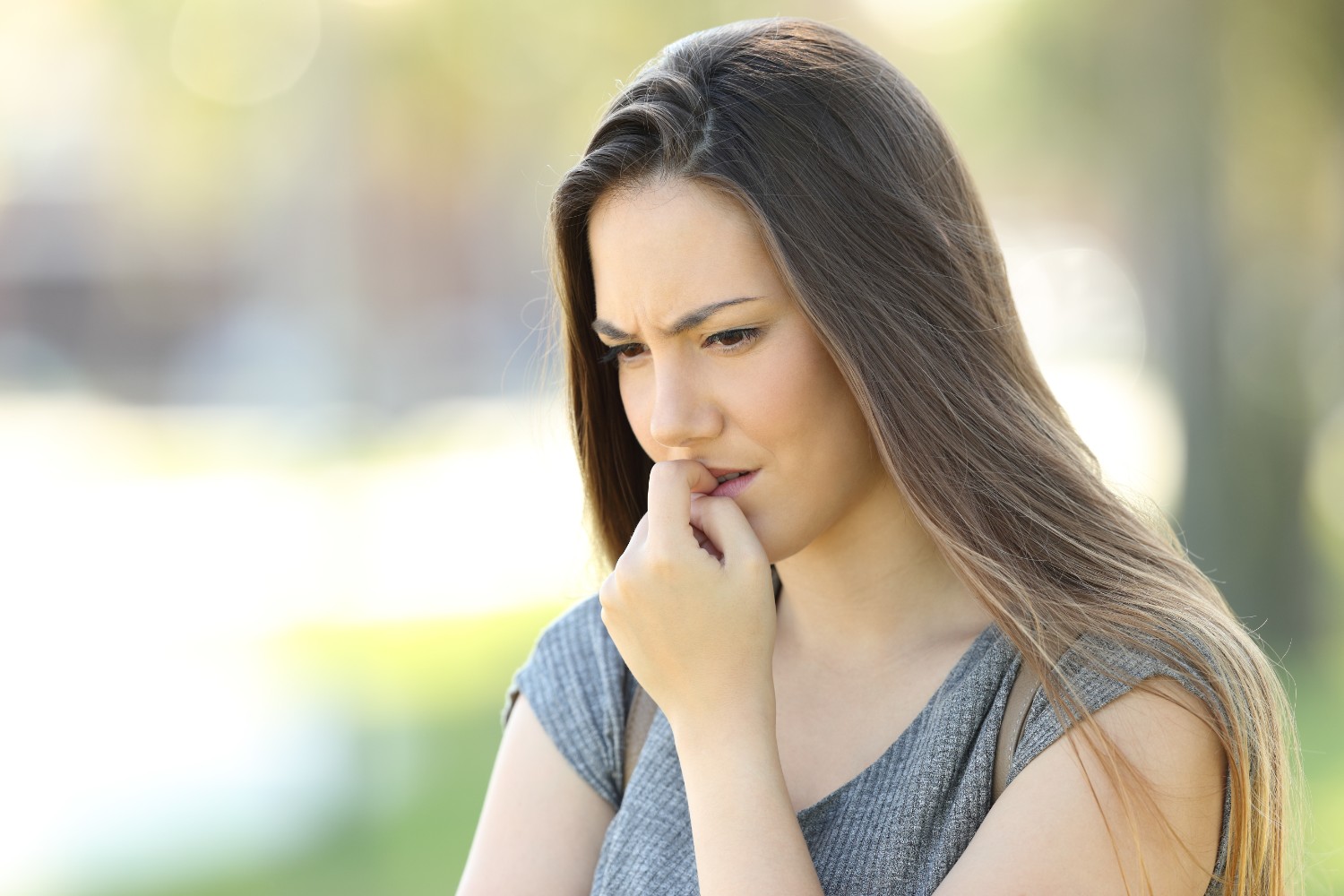 women biting her nails