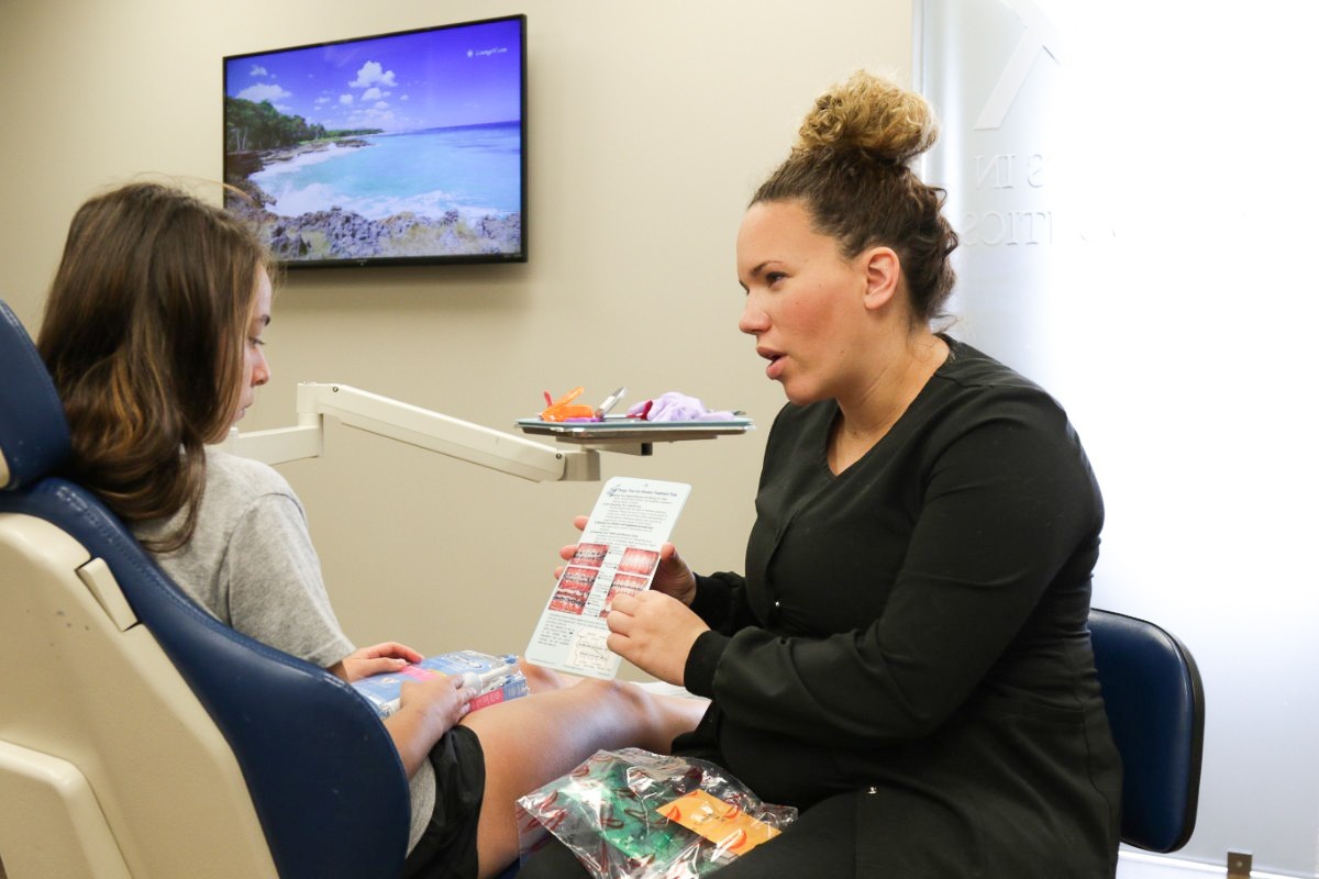 The 5 Best Foods For Braces Dillehay assistant explaining to patient
